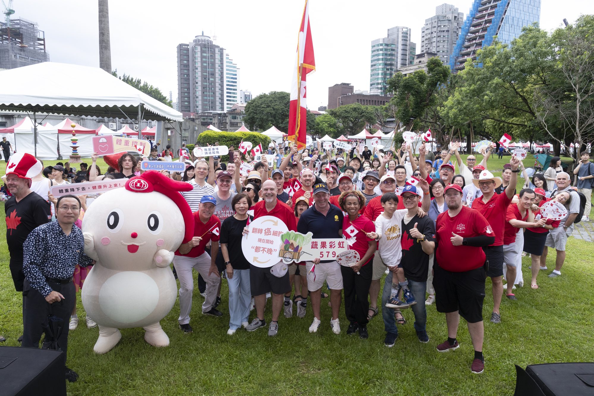 Celebration Canada, with the Taipei skyline behind